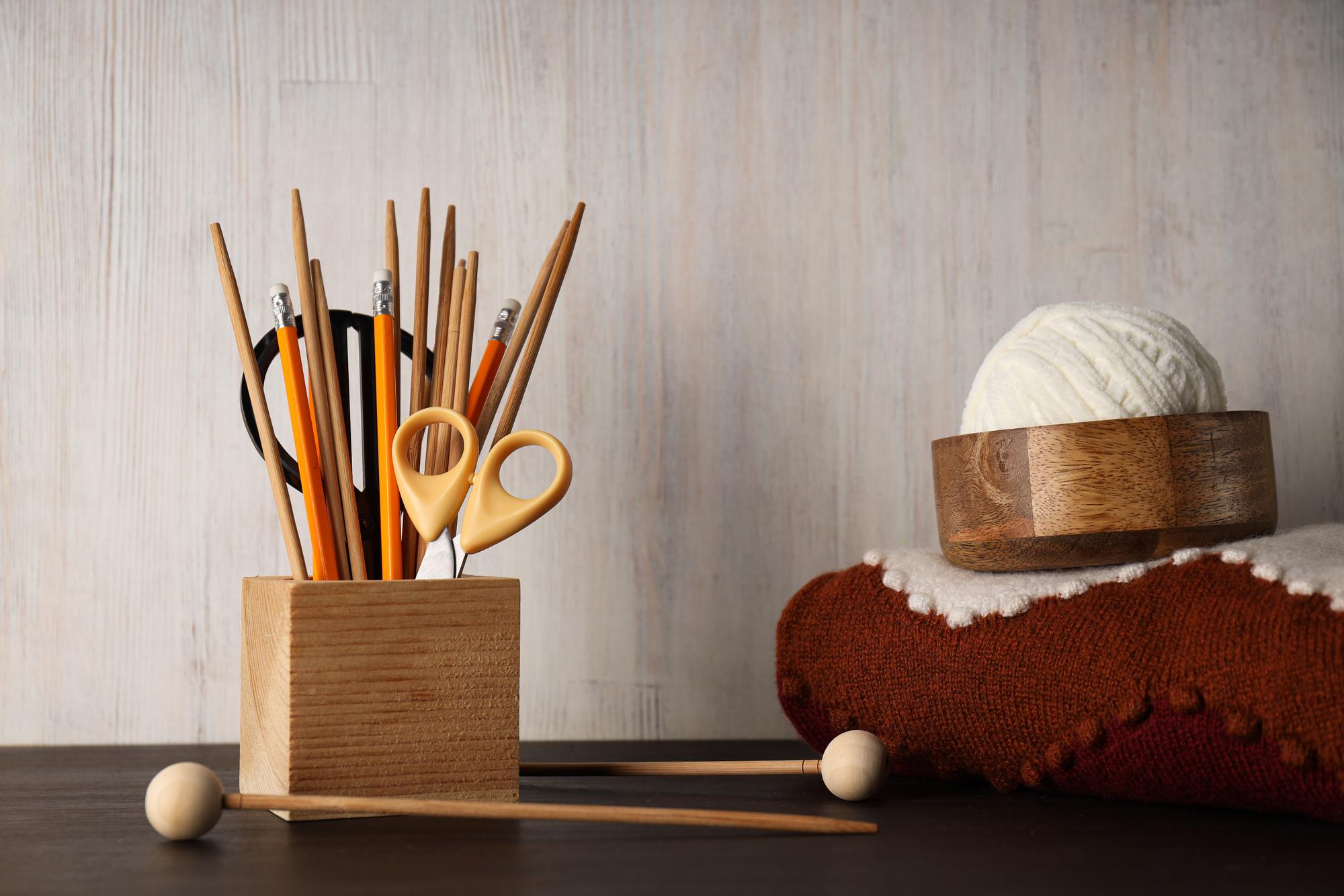 Workshop table with threads, hoops and scissors