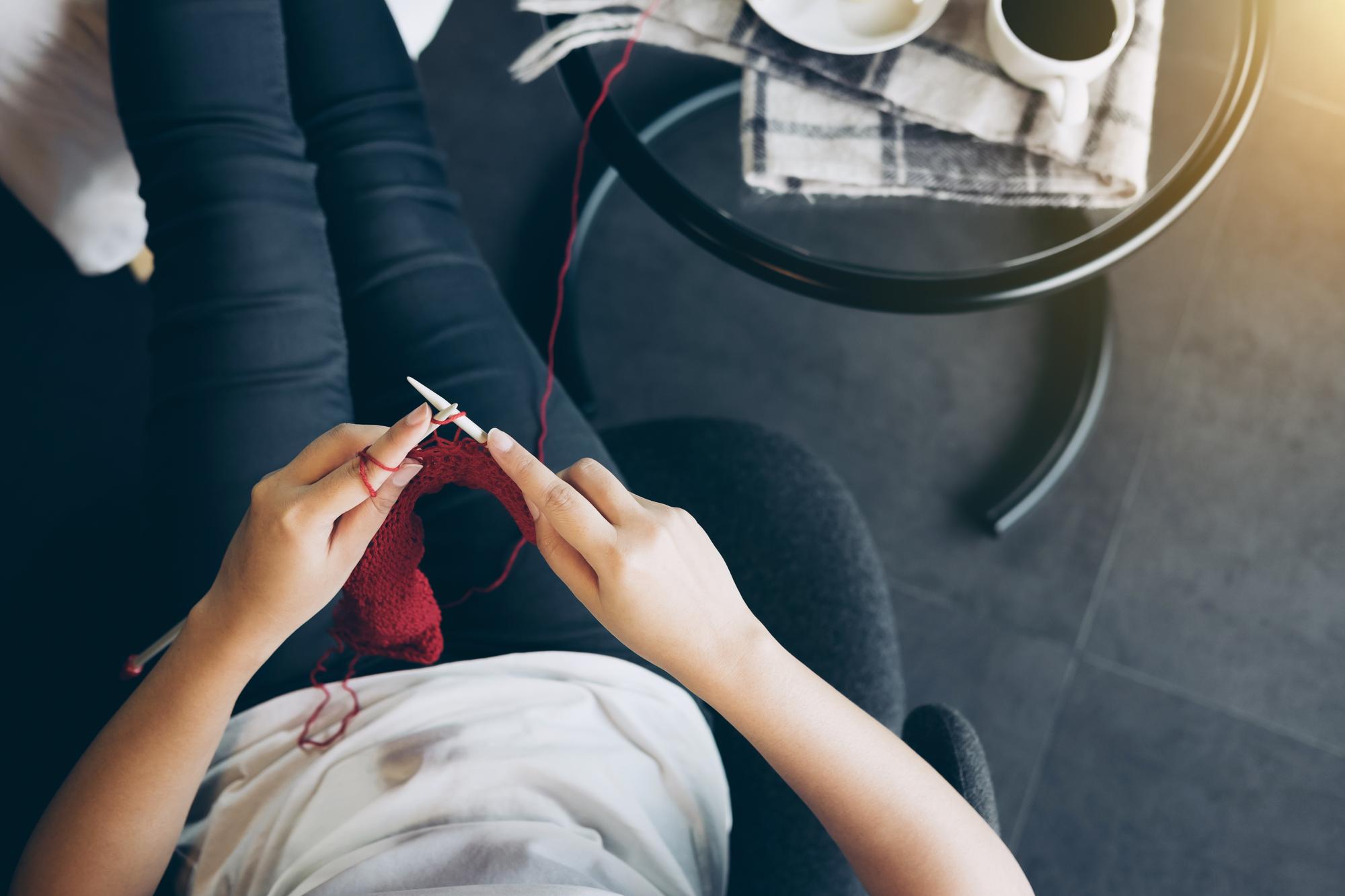 Instructor demonstrating embroidery technique in studio