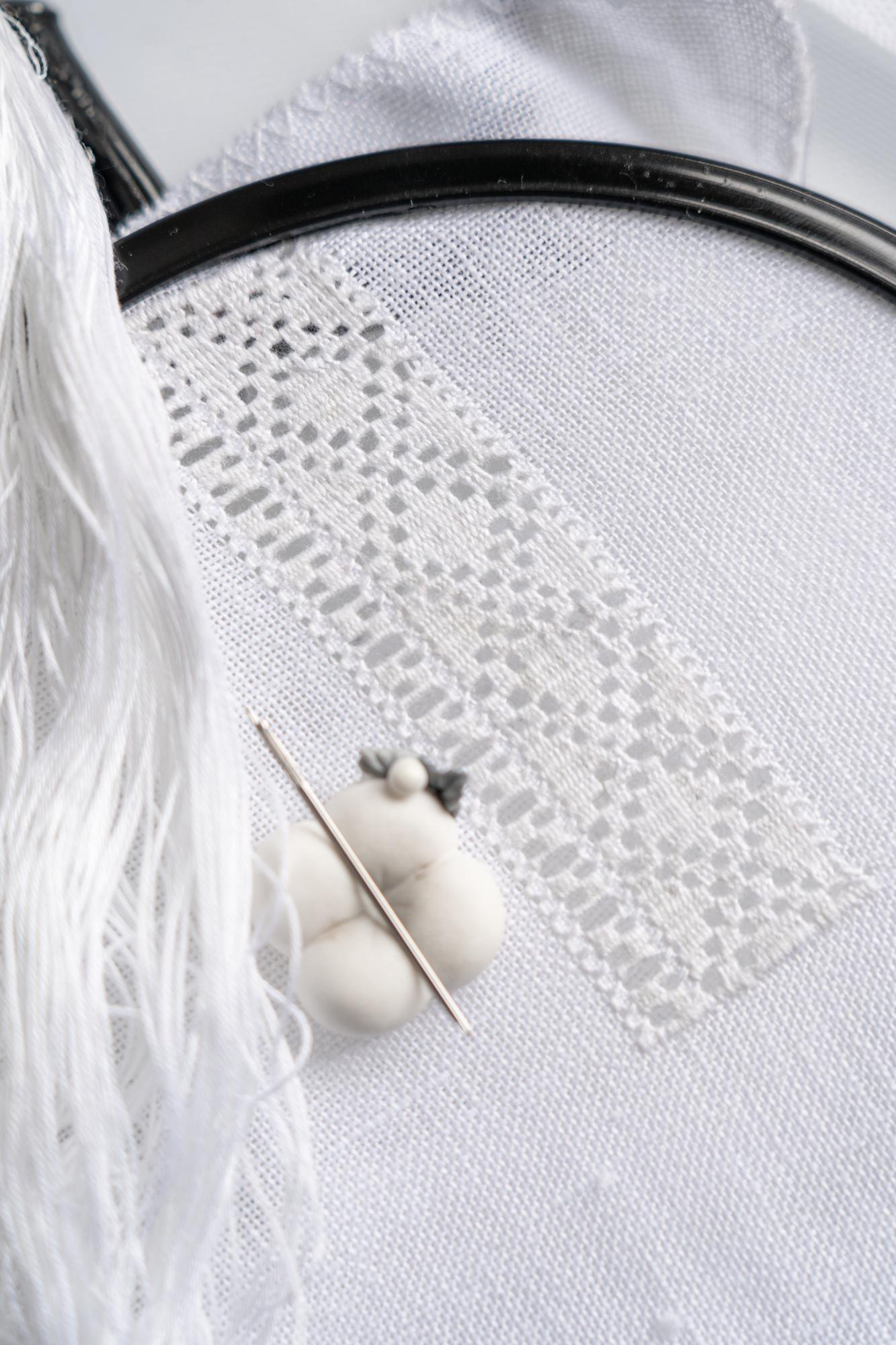 Close-up of satin stitch on silk with shadowing