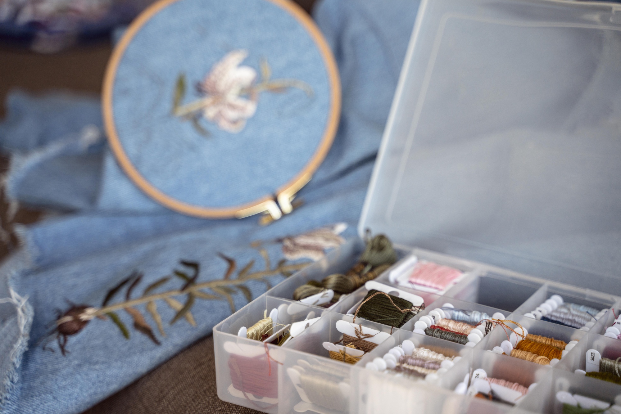 Flatlay of three embroidery kits with labels